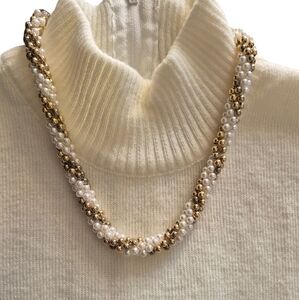 Handmade beaded necklace. White and gold beads